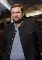 Dieses Bild zeigt das Portrait einer Person.